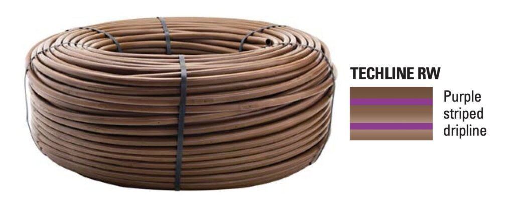 Netfim drip tubing with purple stripes